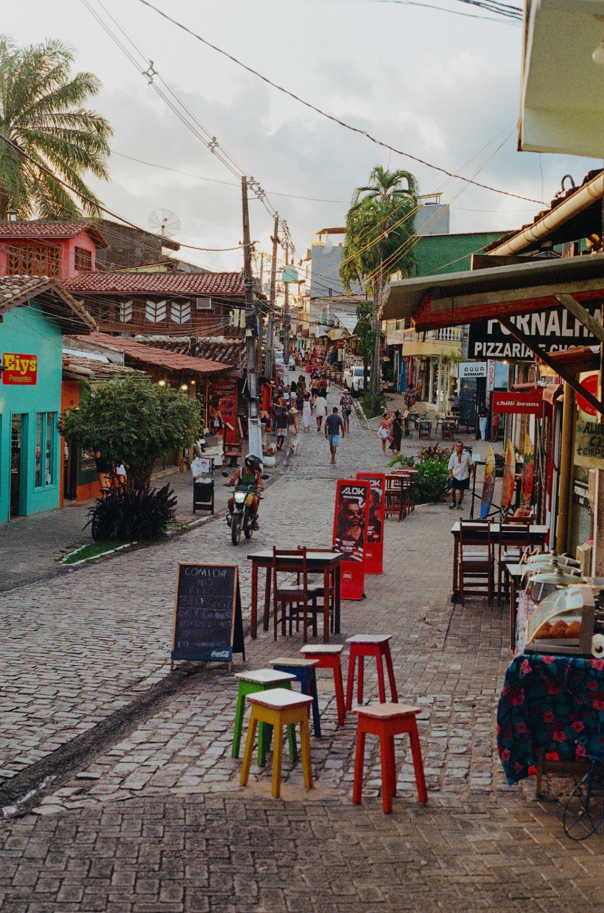 Colorful cobblestone street in a Brazil beach town at dusk
