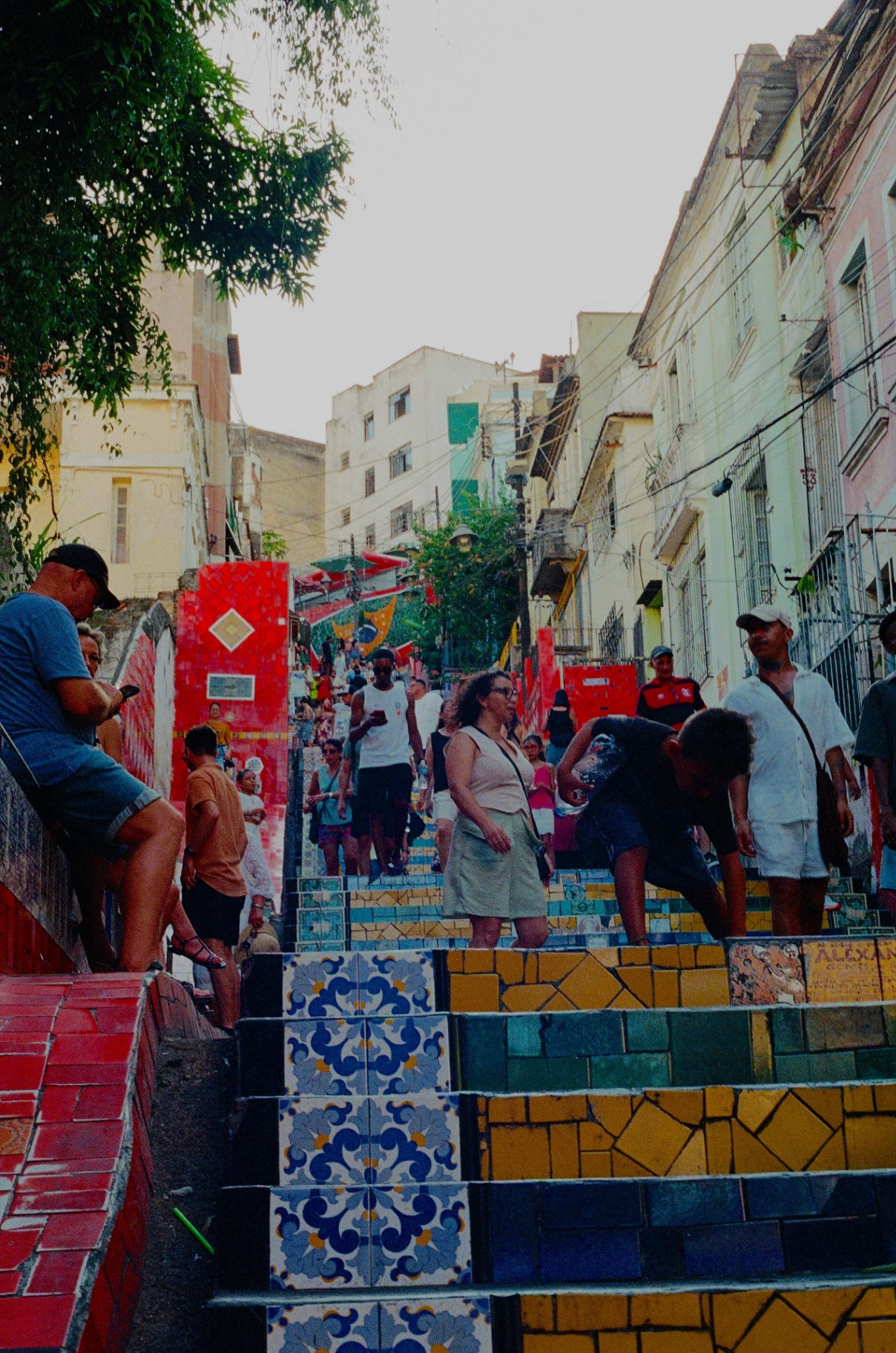Crowds climbing the colorful tiled Escadaria Selarón in Lapa, Rio