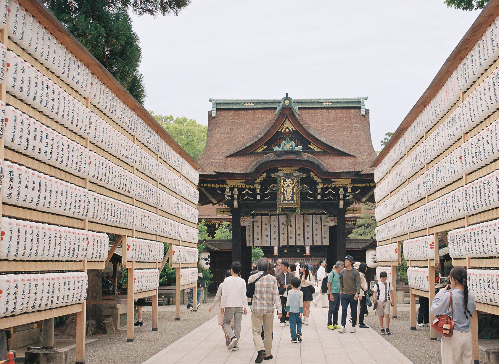 Rows of paper lanterns lining the approach to Kitano Tenmangū shrine in Kyoto