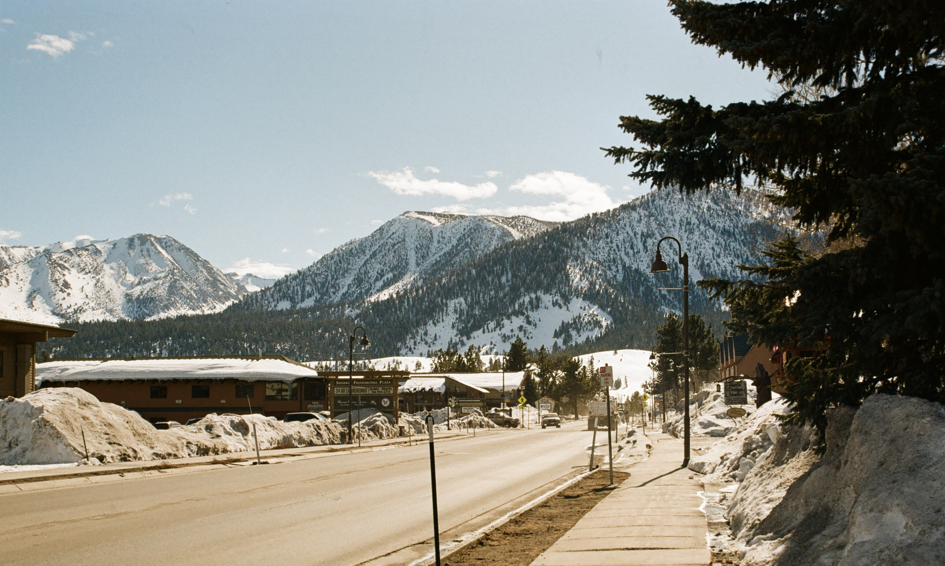 Snowy main street in Mammoth Lakes with the Sierra mountains rising behind