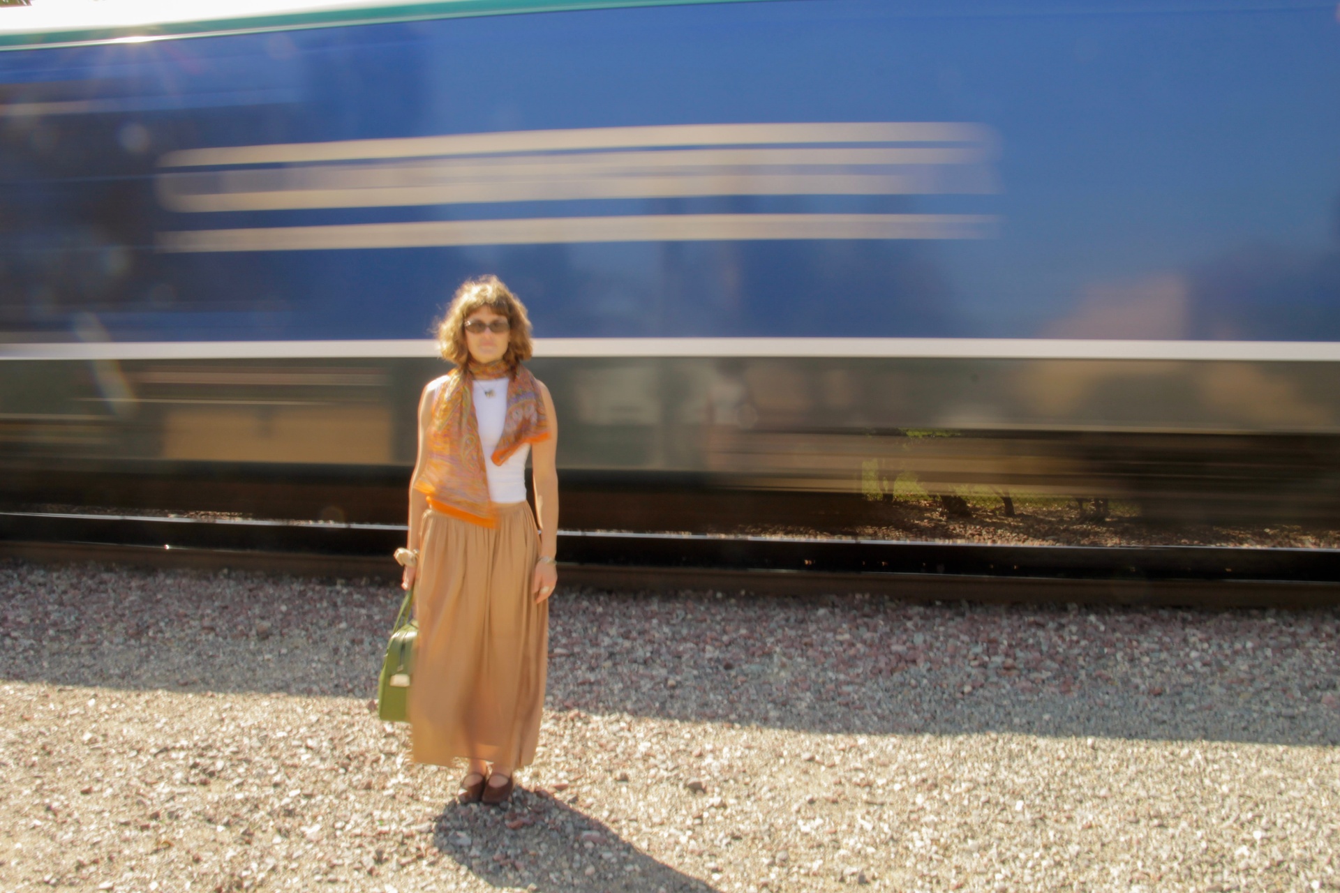 Standing on the platform as the train blurs past