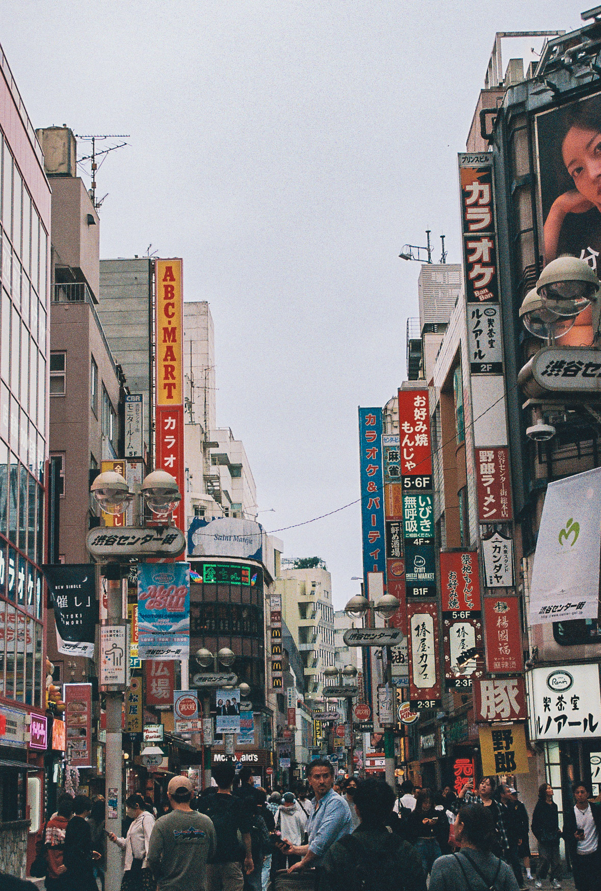 Crowded Shibuya Center-gai street packed with signs and people