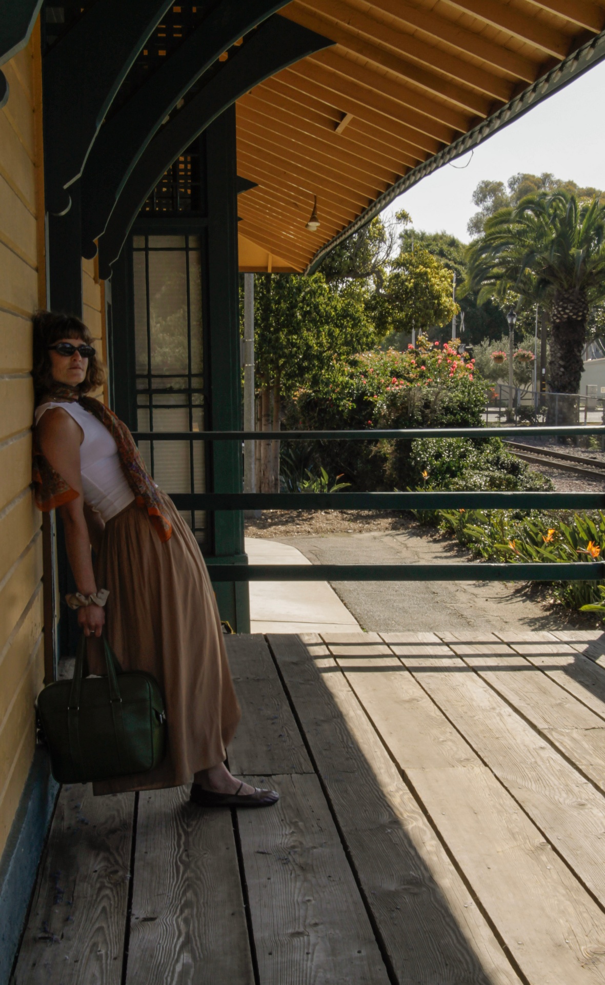 Waiting on the station porch in afternoon shadow